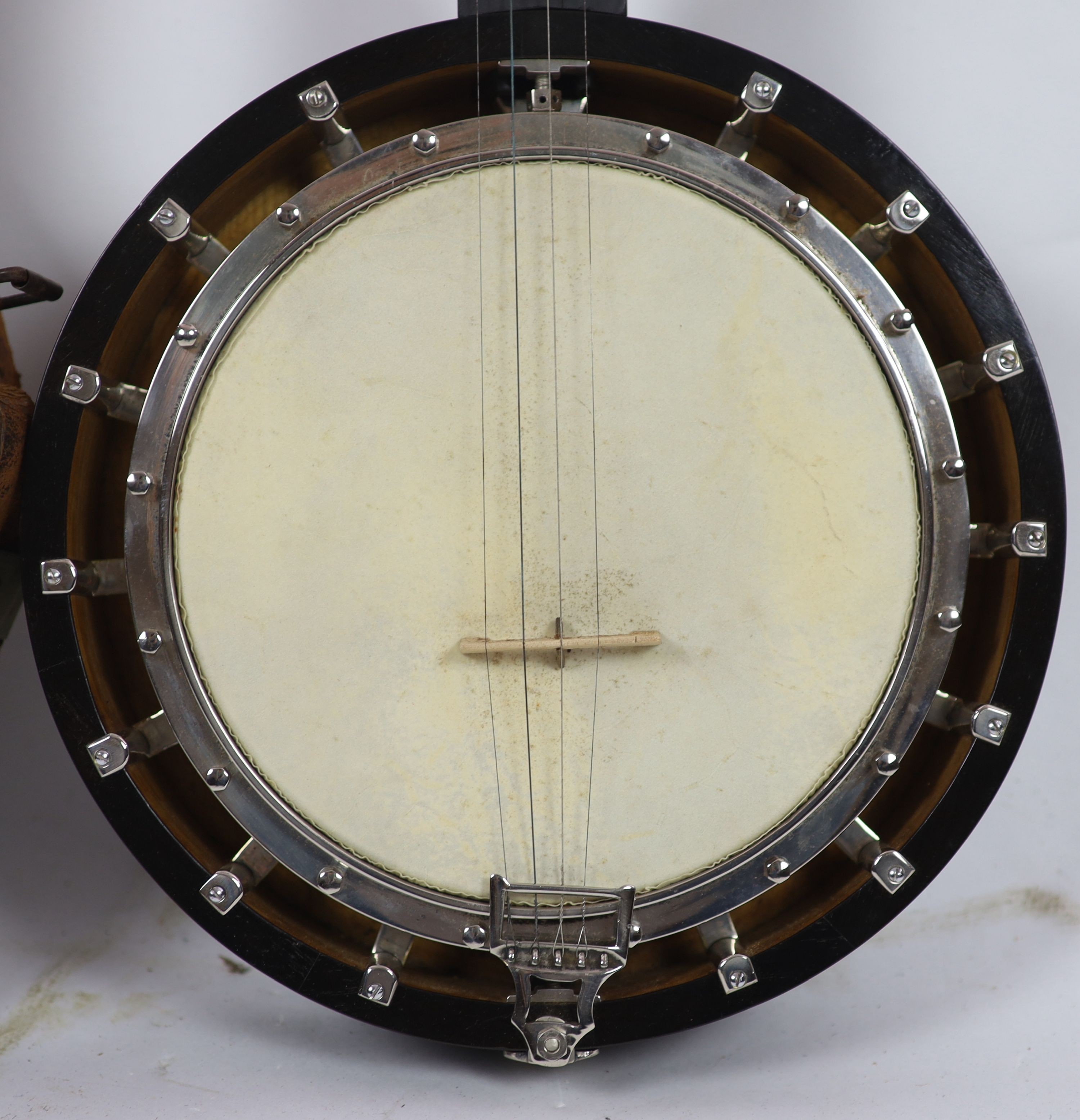 A Clifford Essex inlaid ebony banjo, overall length 94cm, with distressed leather case
